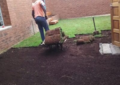 our gardening services worker working on the garden