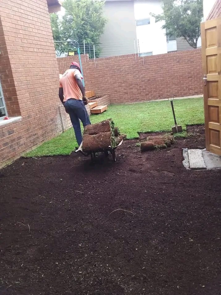 our gardening services worker working on the garden